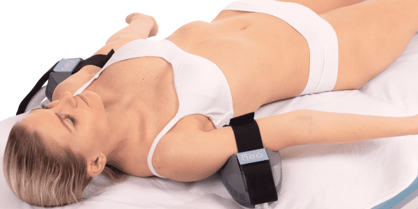 female patient undergoing emsculpt neo at Glow Medispa